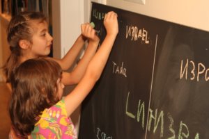 Natalie and Anne writing on board